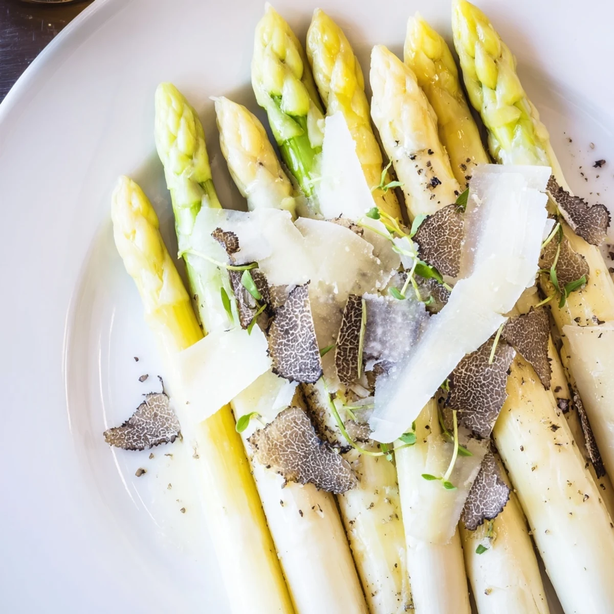 Elegant Silver Birch starter: creamy burrata, tender asparagus, and aromatic truffle shavings await.