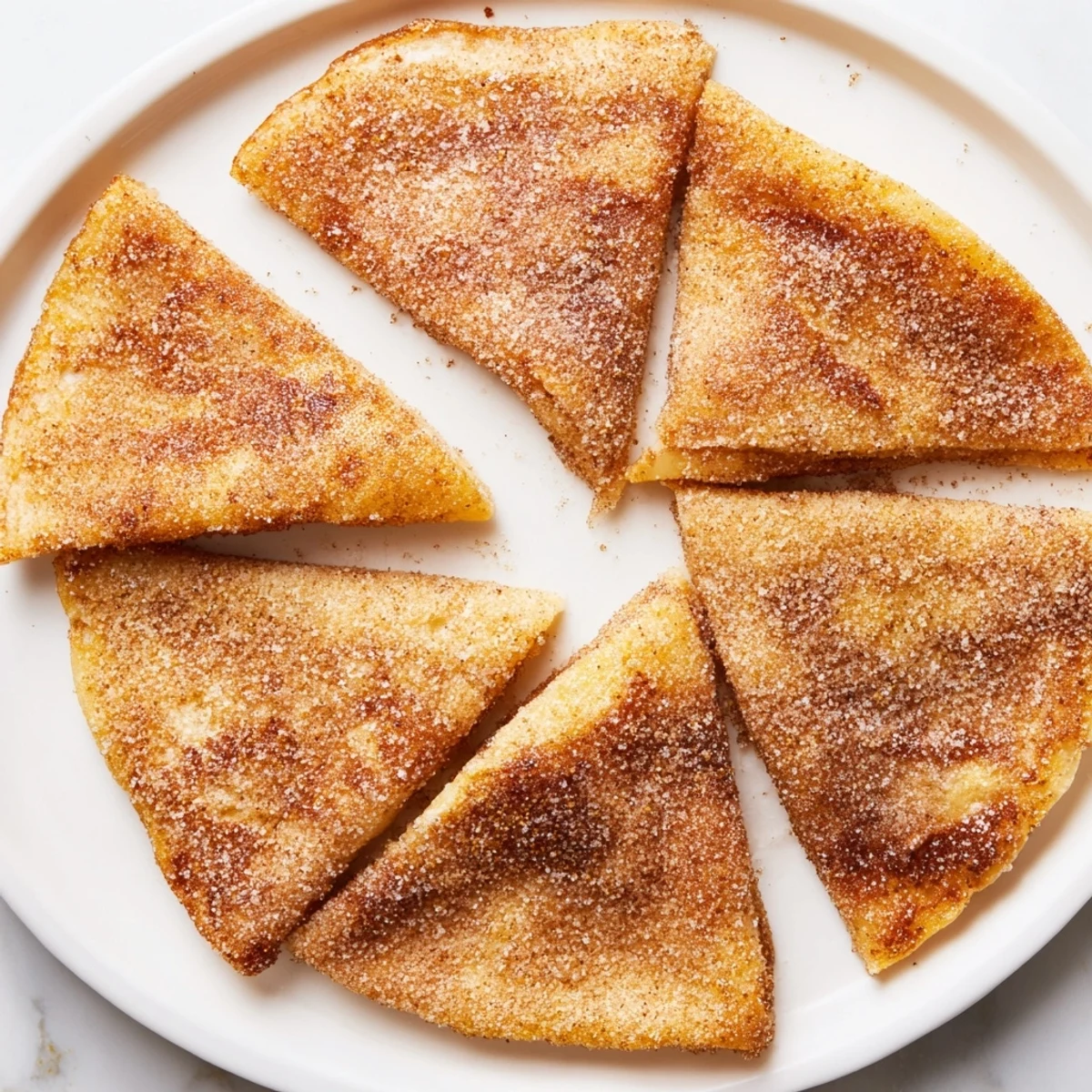 Enjoy sweet, golden cinnamon sugar tortilla chips, ideal for dipping with fresh, vibrant flavors.