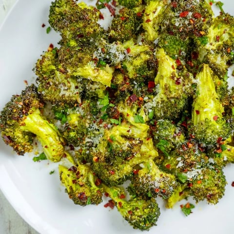 Golden, crispy Garlic Parmesan Roasted Broccoli, ready to serve as a flavorful vegetarian side dish.