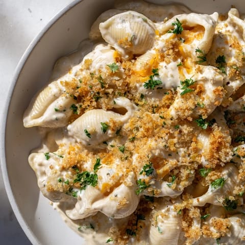 A comforting close-up shot of High-Protein Mac & Cheese, bubbling on a serving plate.