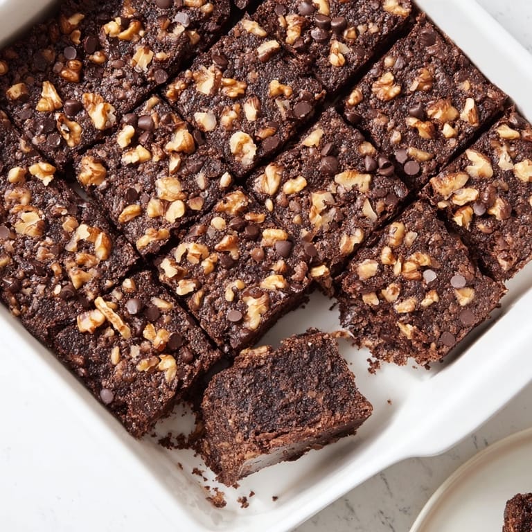 Delicious, fudgy single-pan Fudgy Walnut Brownies, ready to serve and enjoy with a scoop of ice cream.