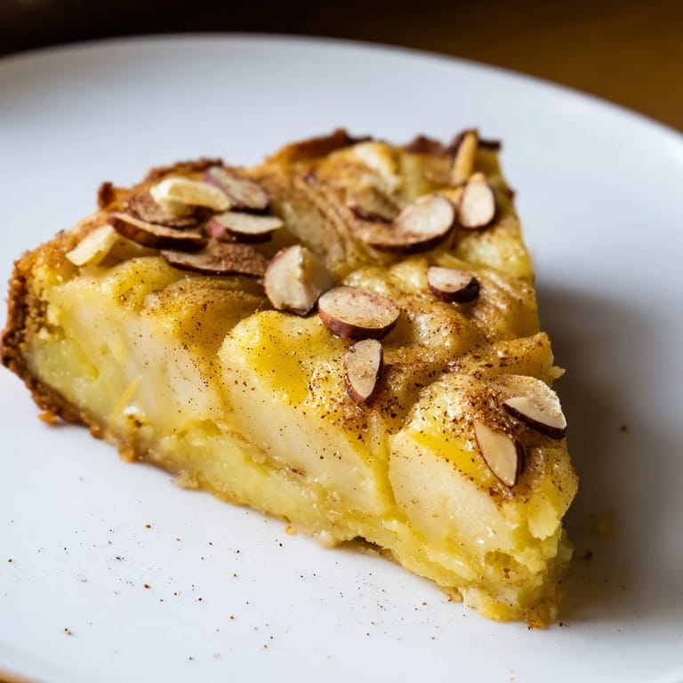 Slice of the amazing Rustic Crustless Apple Pie, served warm with optional creamy vanilla ice cream.