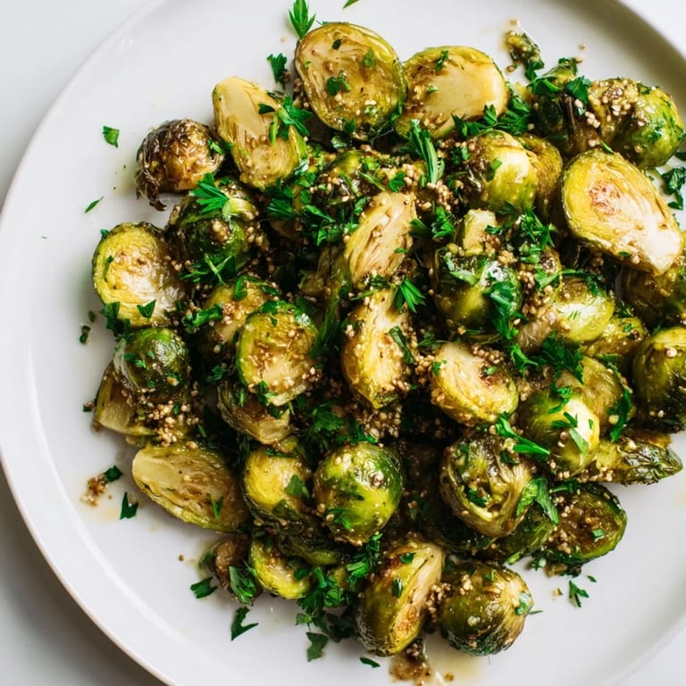 These flavorful Honey Mustard Glazed Brussels Sprouts are coated in a delicious sauce, perfect for a side dish.