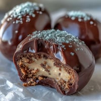 Homemade Peanut Butter Easter Eggs with creamy filling dipped in glossy chocolate, perfect for festive spring celebrations.