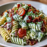 Vibrant BLT pasta salad with creamy avocado ranch, full of fresh summer flavors.